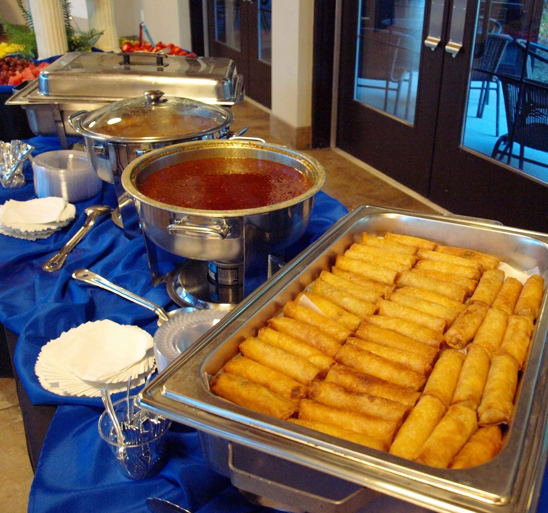 buffet pan filled with egg rolls