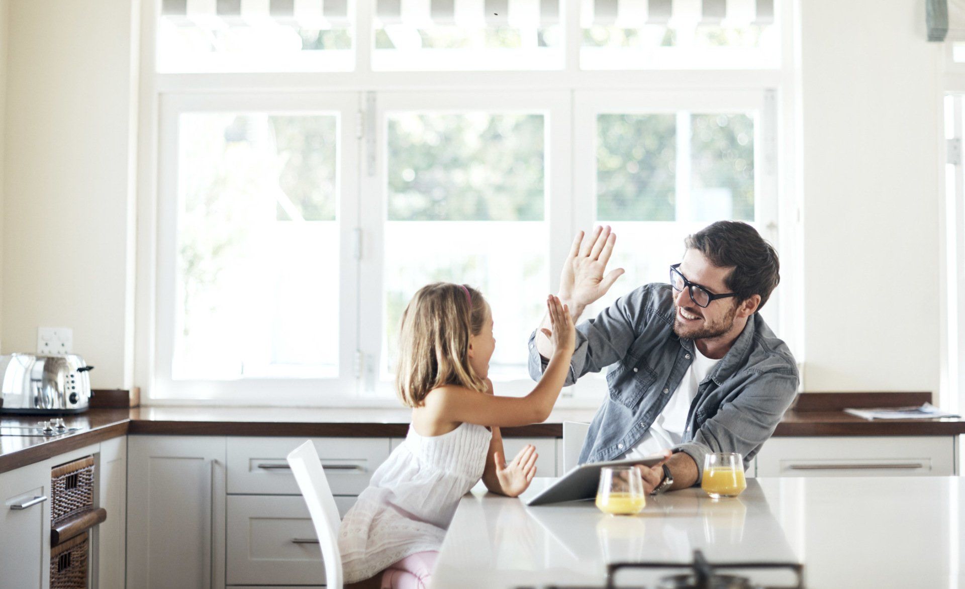 Portrait of a happy young couple in their kitchen at home