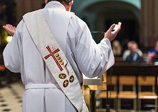 Catholic — Priest Conducting a Mass in Metairie, LA
