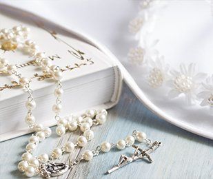 Gulf Coast — Rosary and Bible on Table on Metairie, LA