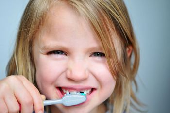 Girl brushing teeth