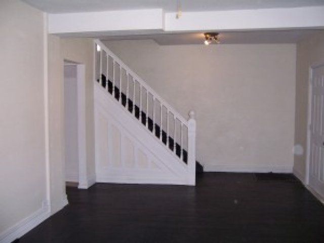 Stair case and living area in 3513 Dewey St | DiBar Enterprises