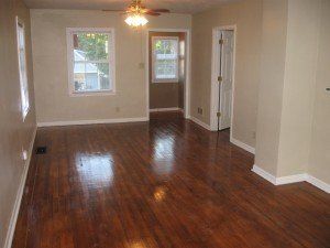 Living room with window view in 3312 Howard St, DiBar Enterprises.