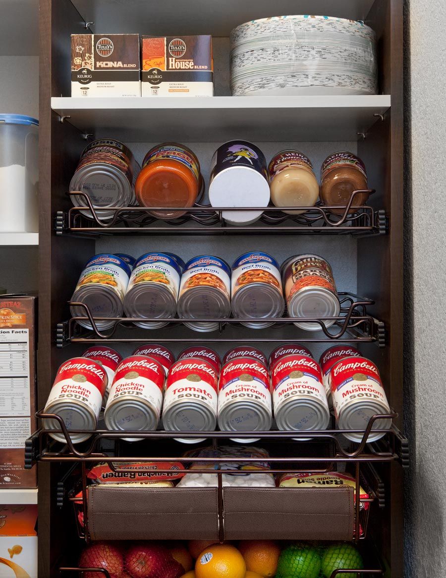 Shelved display of assorted packaged snacks and bottled items in a store aisle