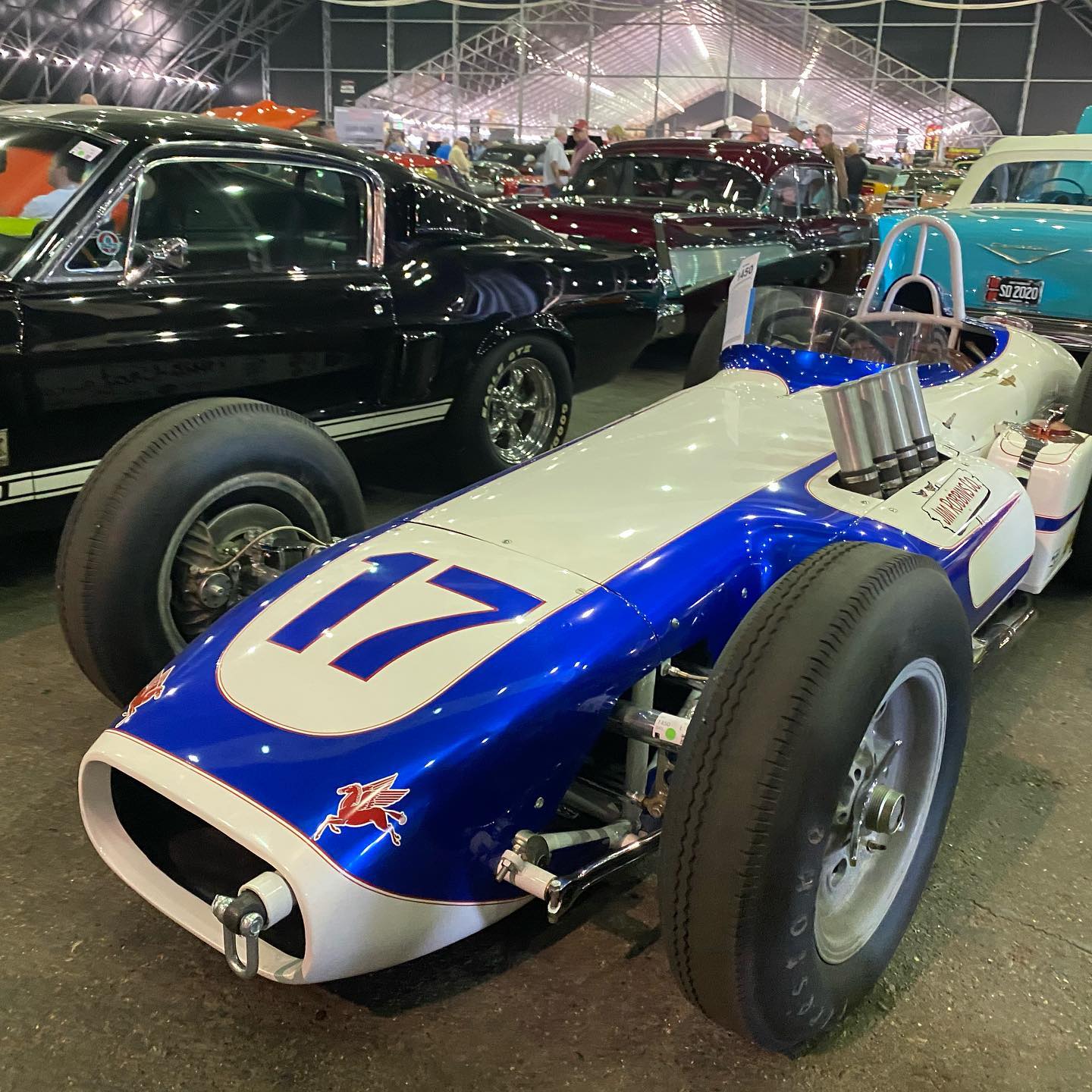 a blue and white race car with the number 17 on it