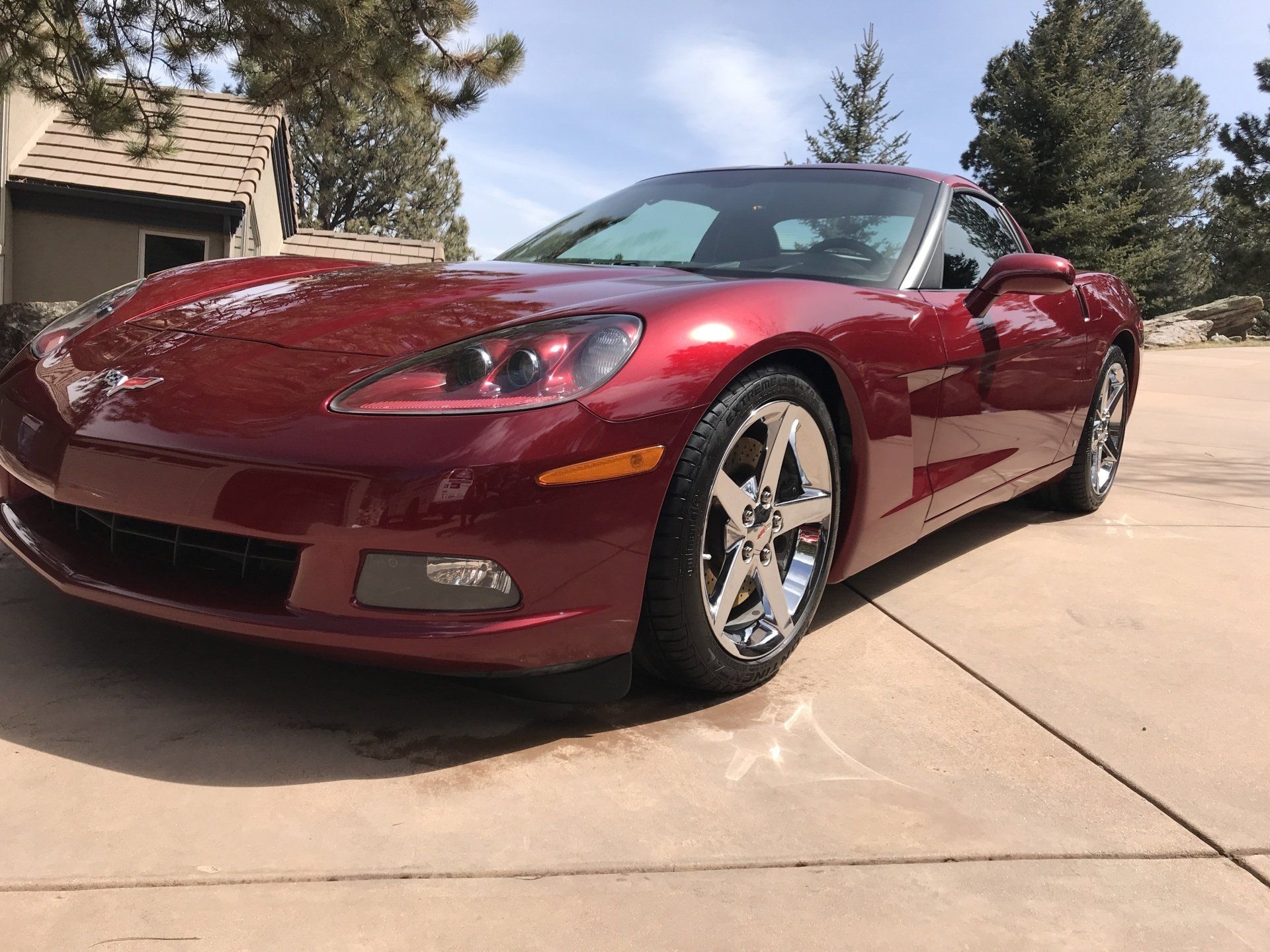 a red sports car parked in a driveway .