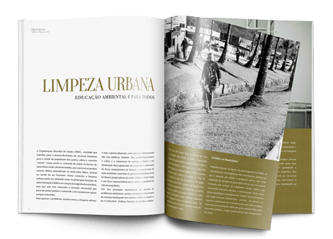 Uma revista está aberta em uma página com a foto de um homem limpando a grama.