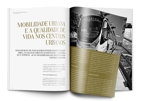 Uma revista está aberta em uma página com a foto de um ônibus.