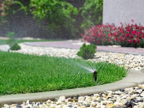 Irrigation Equipment & Systems — Sprinkler In Trench in Portage, MI Home with irrigation equipment in Kalamazoo, MI