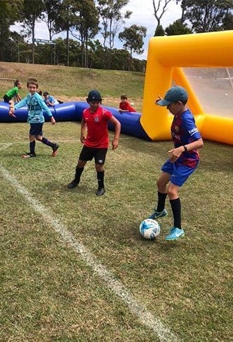 Juniors Playing Football — Football Clubs in Kingscliff, NSW Juniors Playing Football — Football Clubs in Kingscliff, NSW