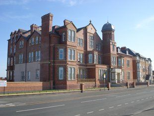A picture showing the outside of Marina Apartments
