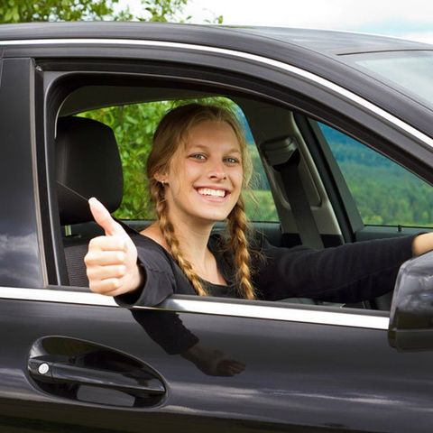 Key to success - car L plate being torn