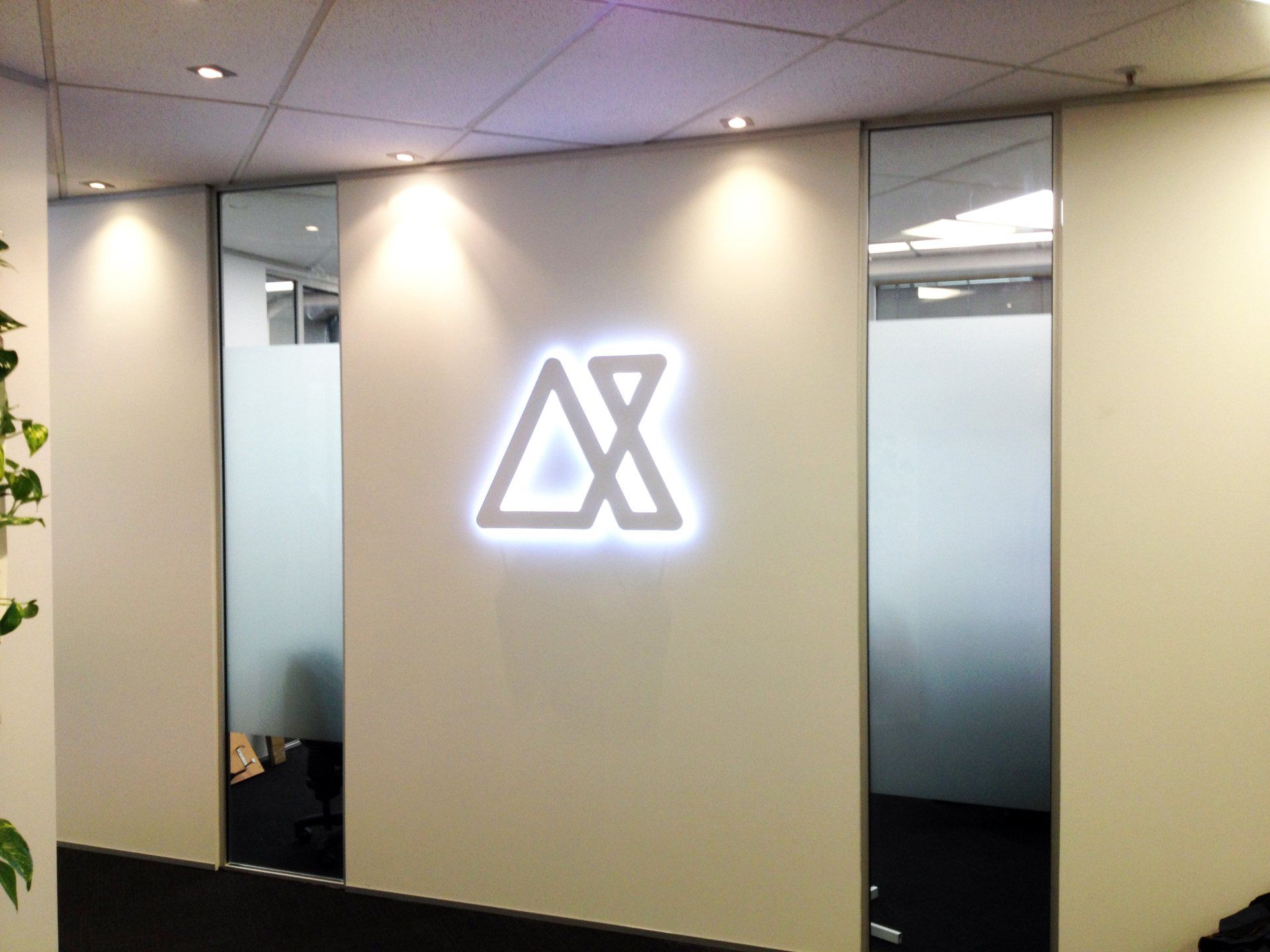 3D laser cut acrylic with LED back lighting mounted onto foyer wall