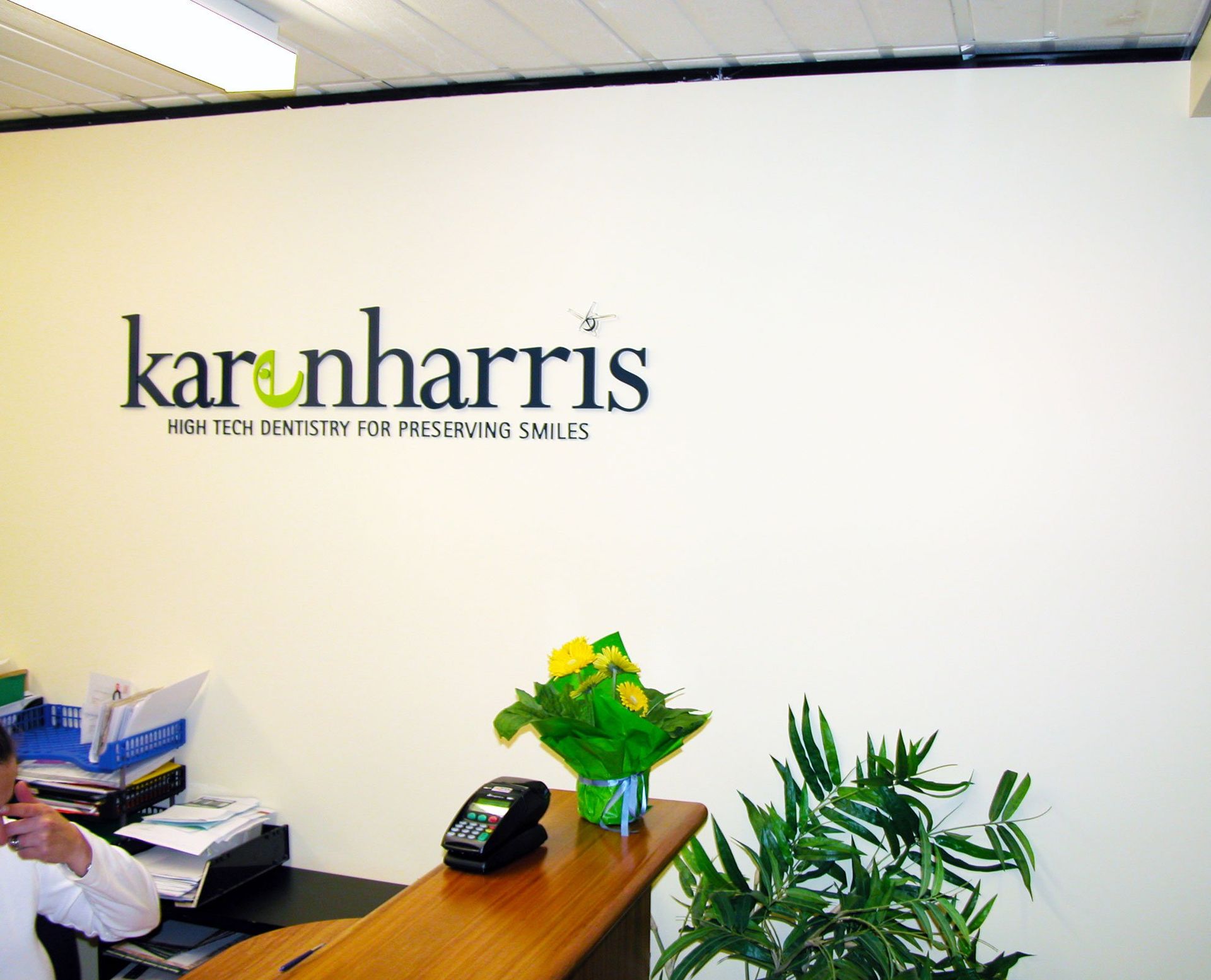 10mm and 6mm thick router cut acrylic lettering installed directly to internal wall of office reception area