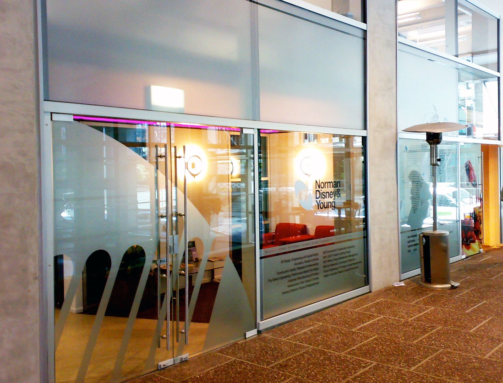 Window etch film and computer cut vinyls applied to office glazing