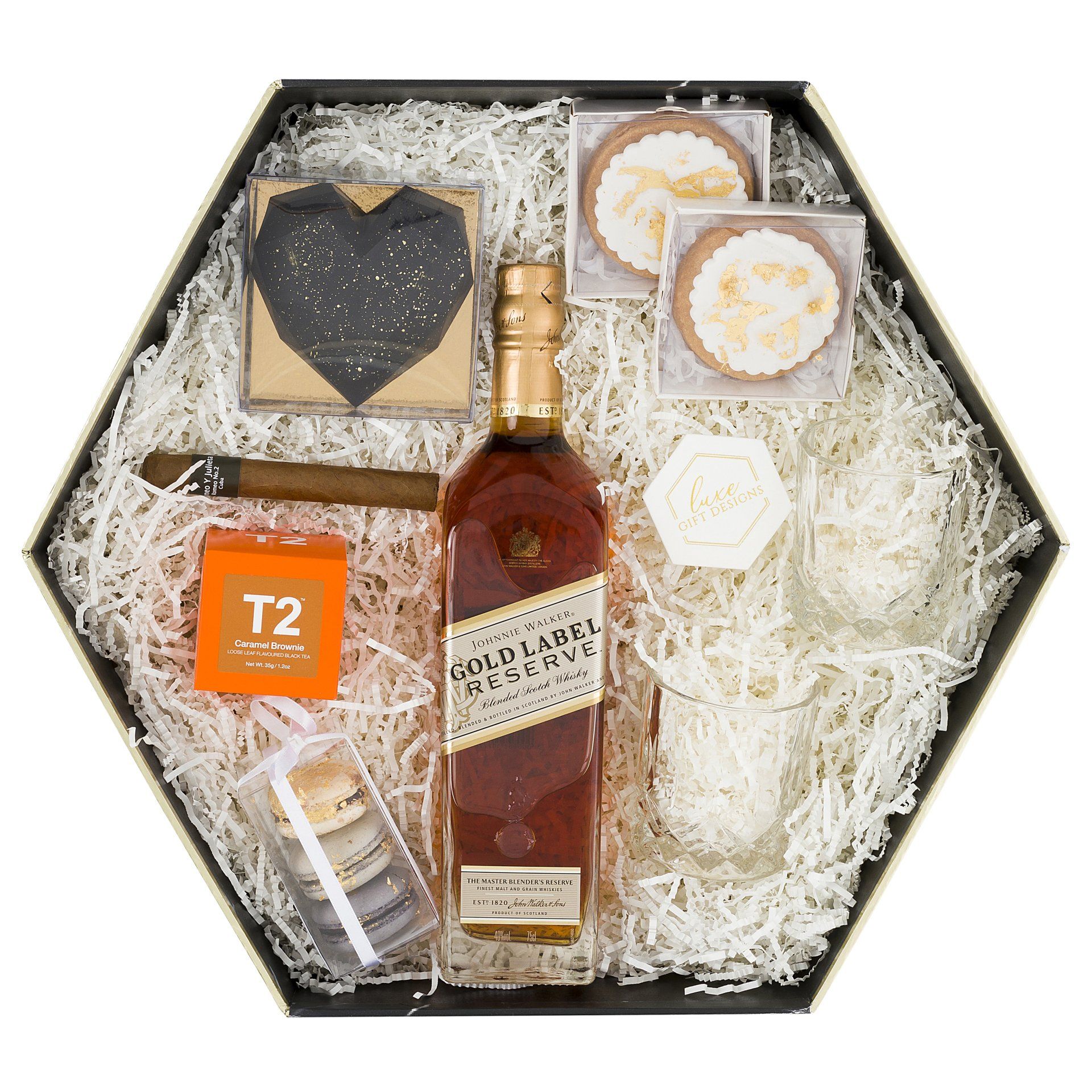 black box with Gold label, glass, tobacco and macarons inside