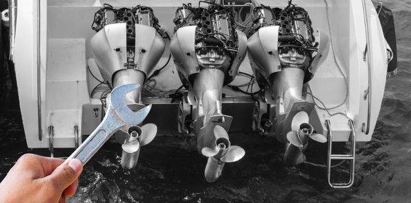 mechanic with spanner repairing nautical engines