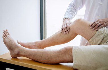 Therapist Checking Patients Knee — Reno, Nevada — ATS Physical Therapy Therapist Checking Patients Knee — Reno, Nevada — ATS Physical Therapy