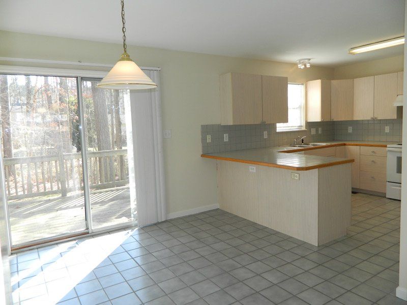 The kitchen and dining area at Timber Drive duplexes