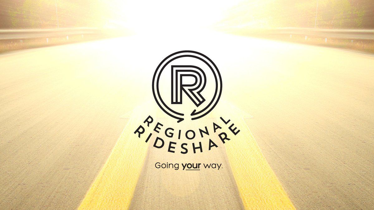 Regional Rideshare logo with road background. The logo is a circled 