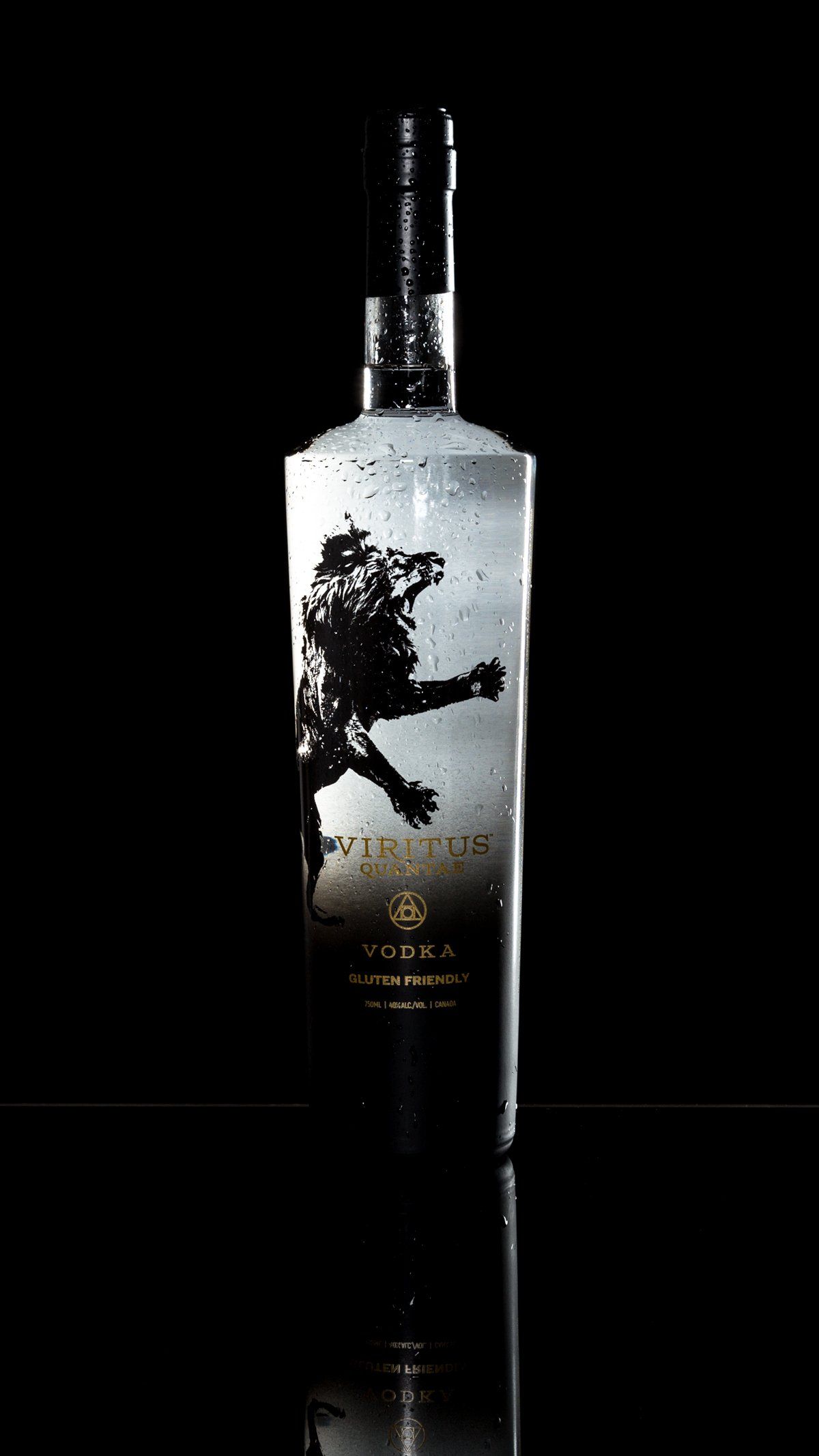Vodka bottle with dark, abstract design of a figure, on black background.