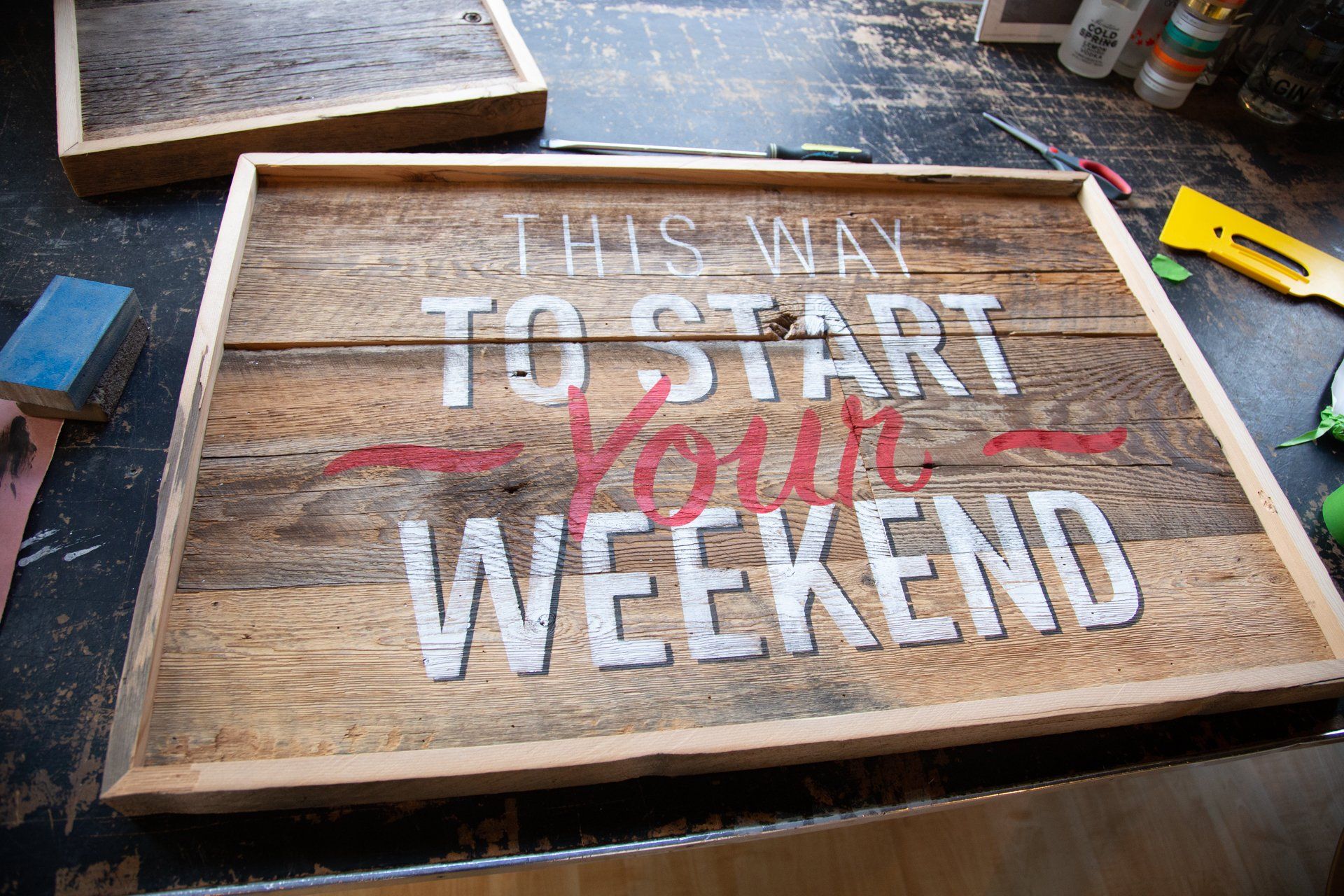 Wooden sign that reads 