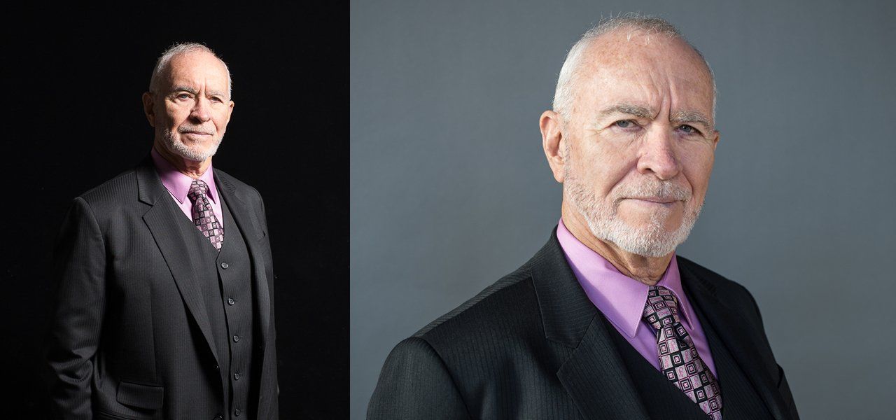 Two portraits of a man in a black suit, pink shirt, and patterned tie. One on a dark background, the other on grey.