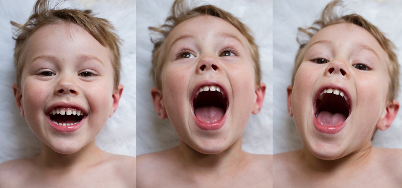 A child with light hair, in three panels. Laughing, then with mouth wide open. On a white background.