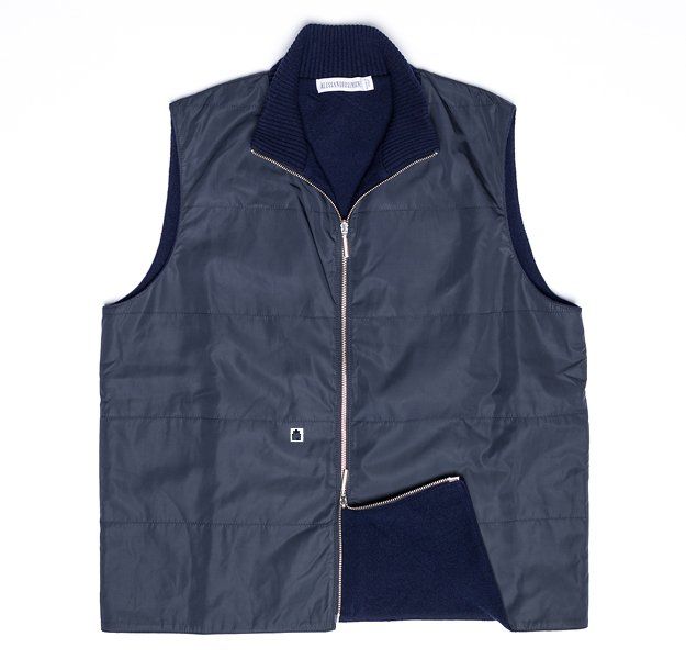 Navy blue reversible vest with zip closure and ribbed collar.