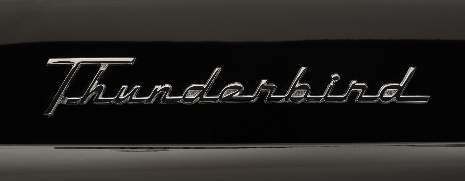 55 thunderbird badge close up