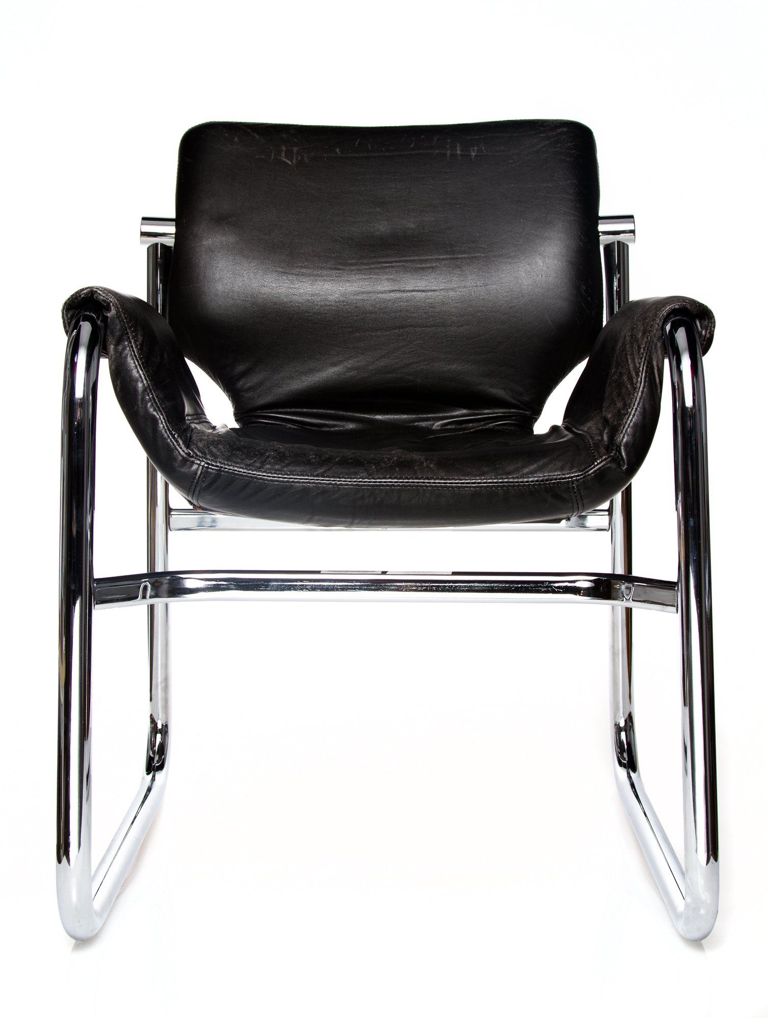 Black leather chair with chrome frame.
