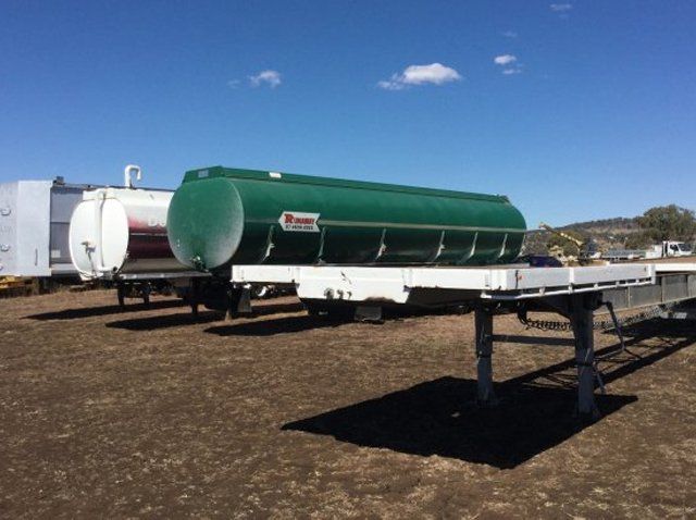white and green truck trailers 