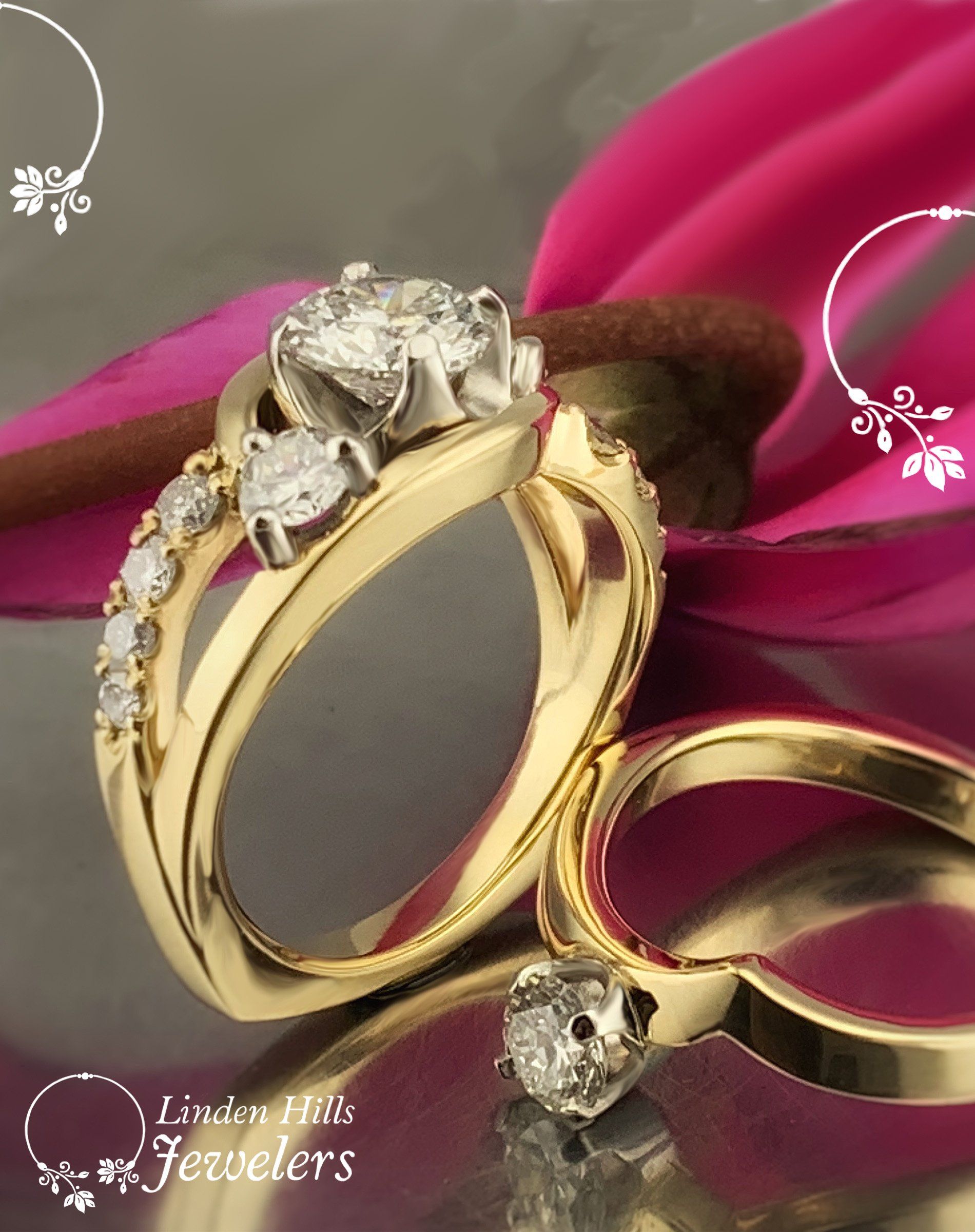 A couple of gold rings with a pink flower in the background