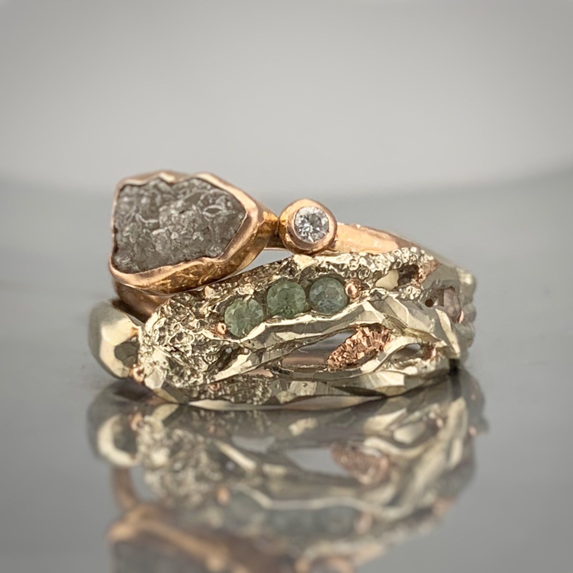 A couple of rings stacked on top of each other on a table.