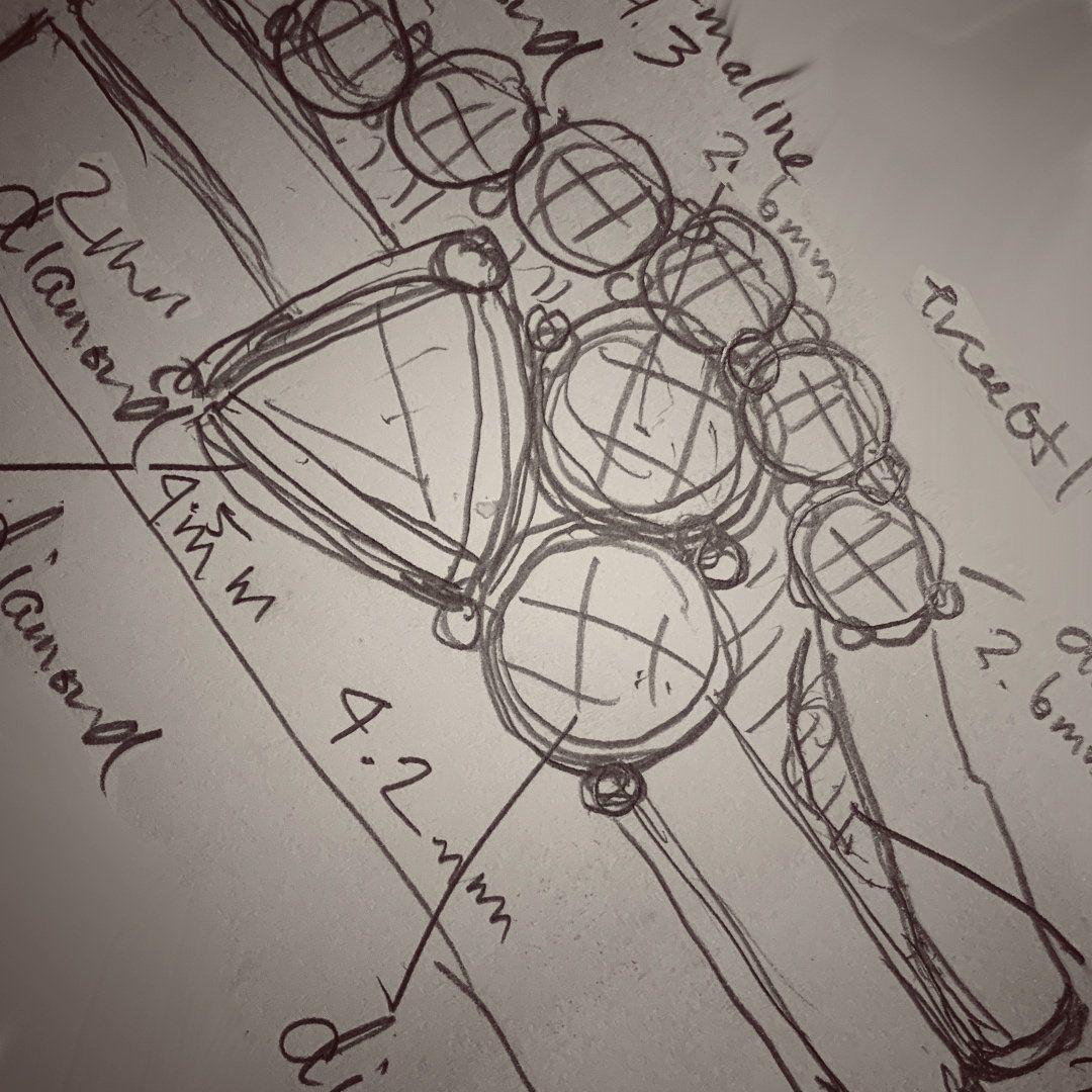 A black and white drawing of a diamond ring