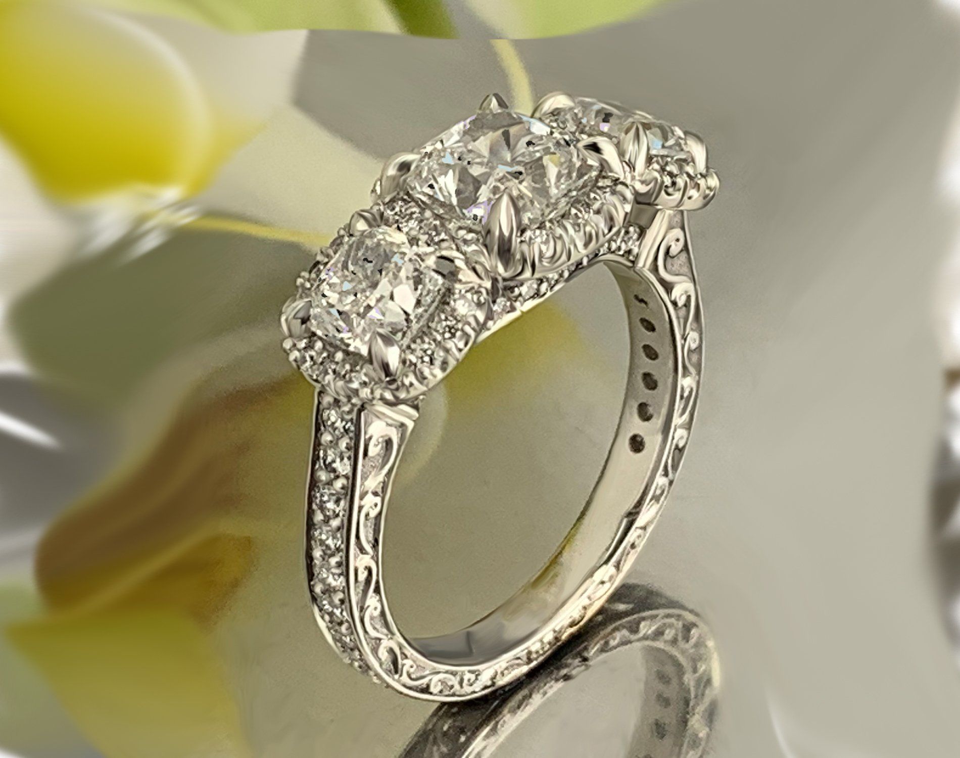 A diamond ring is sitting on a table with flowers in the background