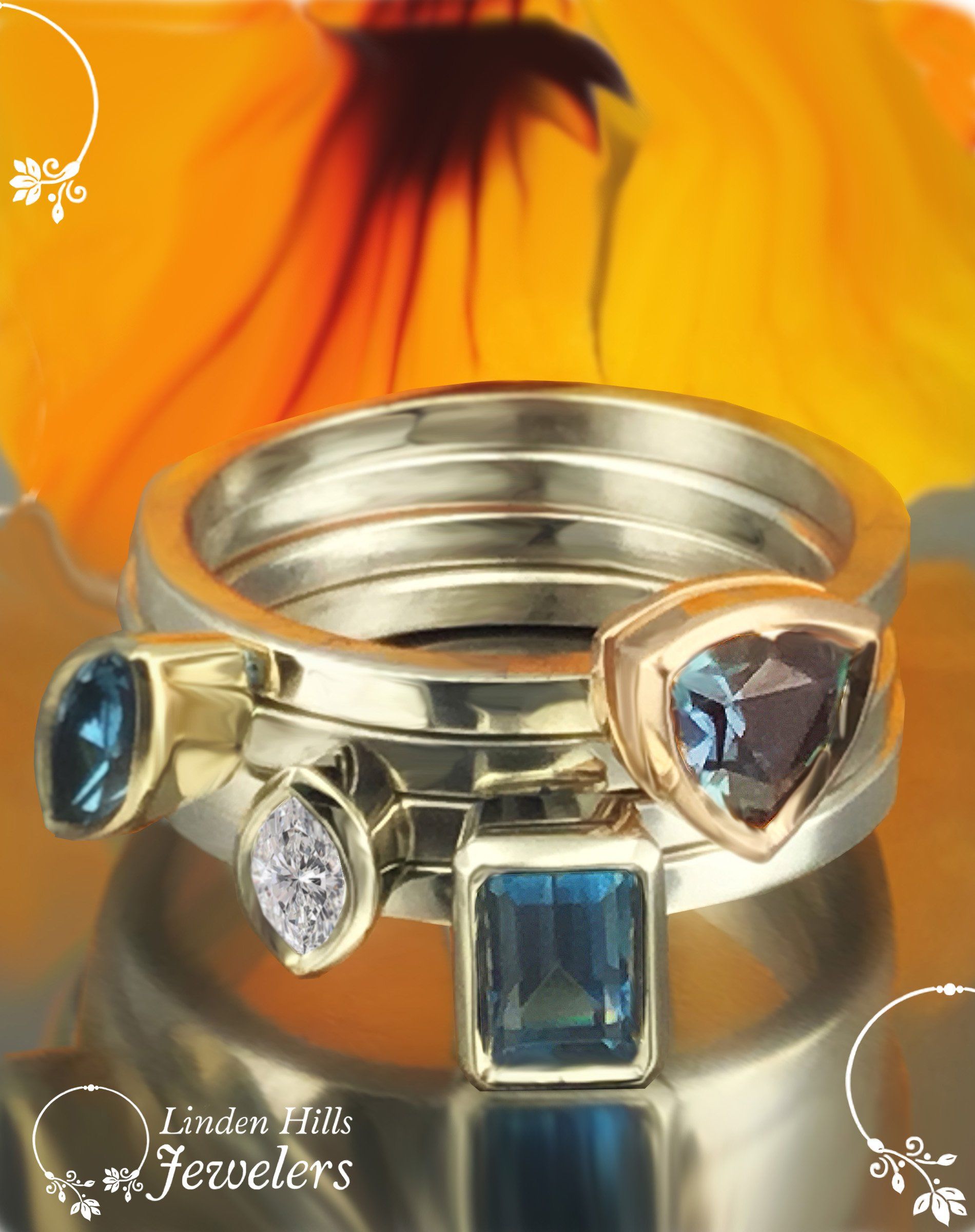 Three rings are stacked on top of each other with a flower in the background