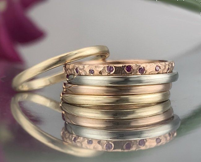 A stack of rings sitting on top of each other on a table.