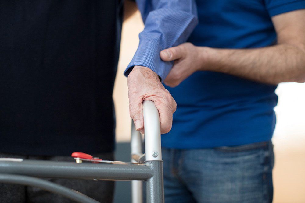 Home Care — Senior Man's Hands on Walking Frame in Columbus, OH Home Care — Senior Man's Hands on Walking Frame in Columbus, OH