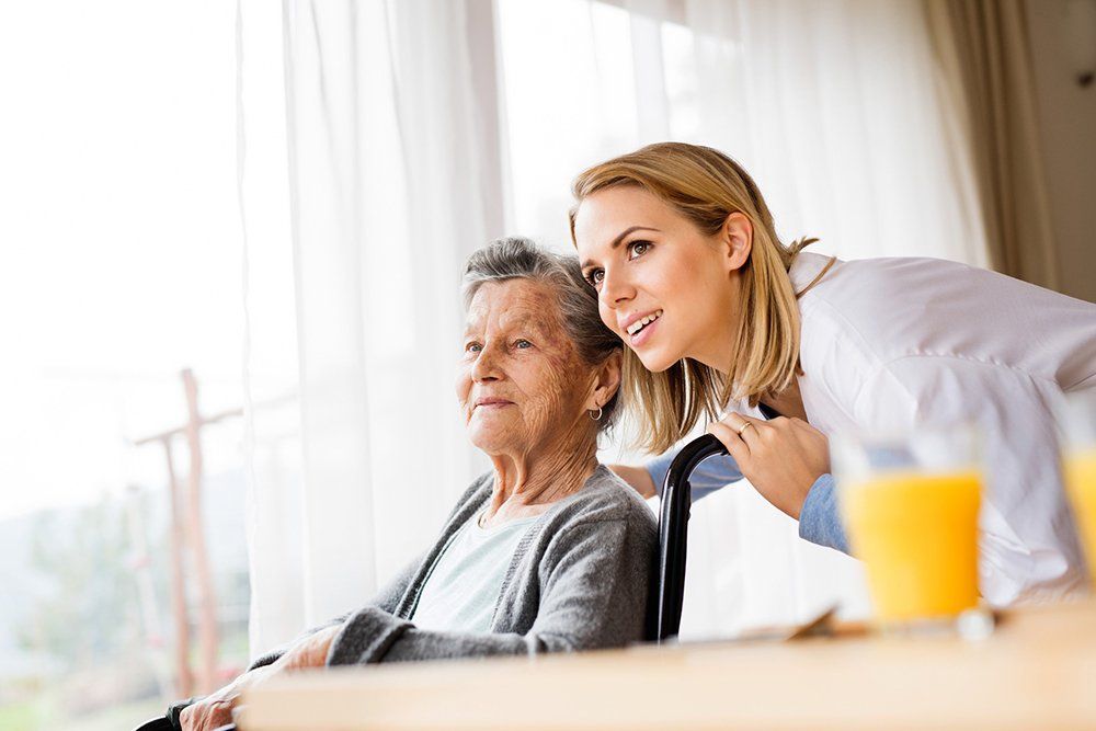 Certified Caregiver — Health Visitor and A Senior Woman in Columbus, OH Certified Caregiver — Health Visitor and A Senior Woman in Columbus, OH