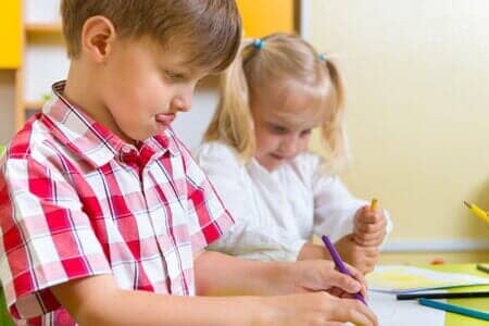 Two cute little preschool kids drawing in Lombard, IL