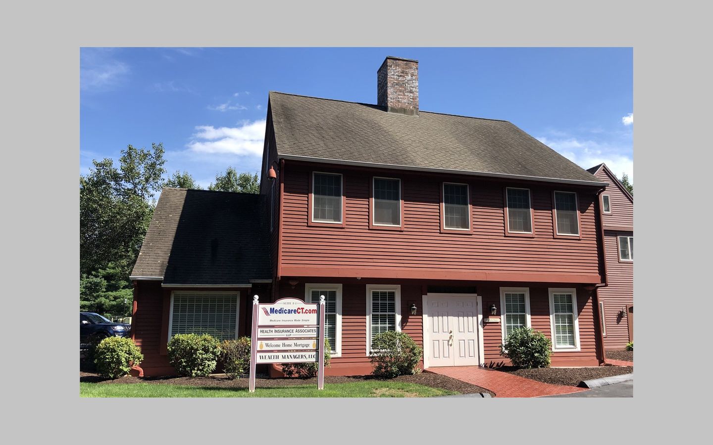 a red house with a sign that says medicare on it