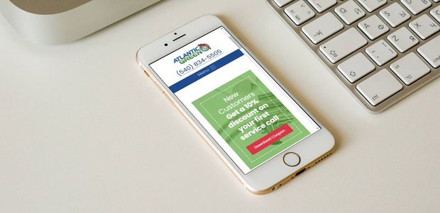 Mobile Phone Showing An Advertisement For Atlantic Green Plumbing
