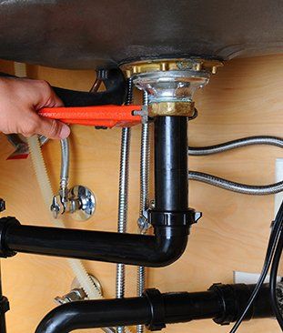Plumbing Repair Under A Sink
