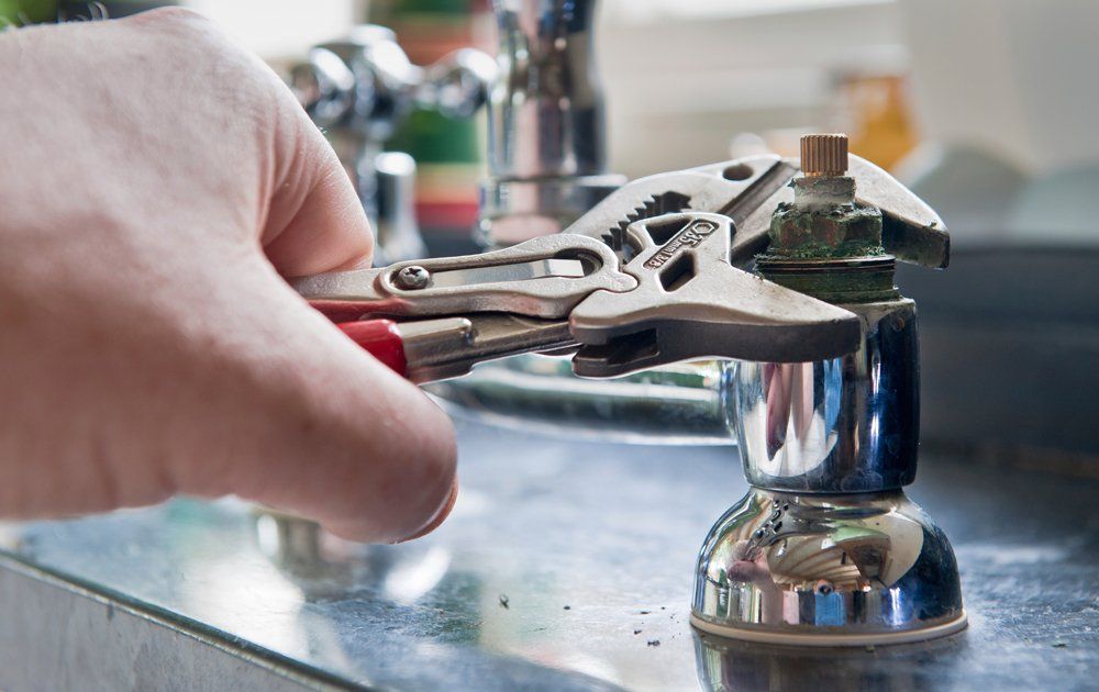 Plumber Using Wrench — Evansville, IN — Gary's Plumbing Service Inc