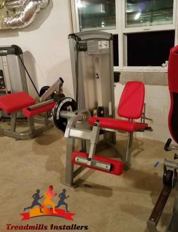 A treadmills installers logo is displayed in a gym