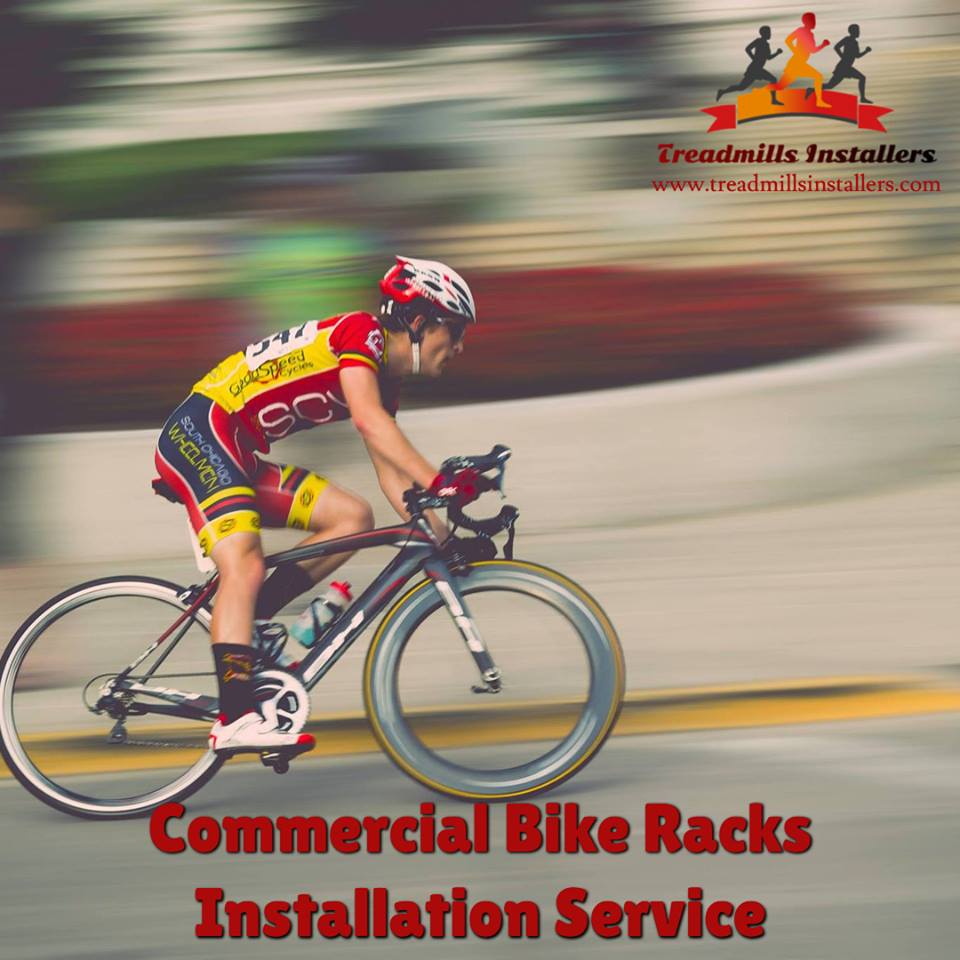 A person riding a bike with the words commercial bike racks installation service on the bottom