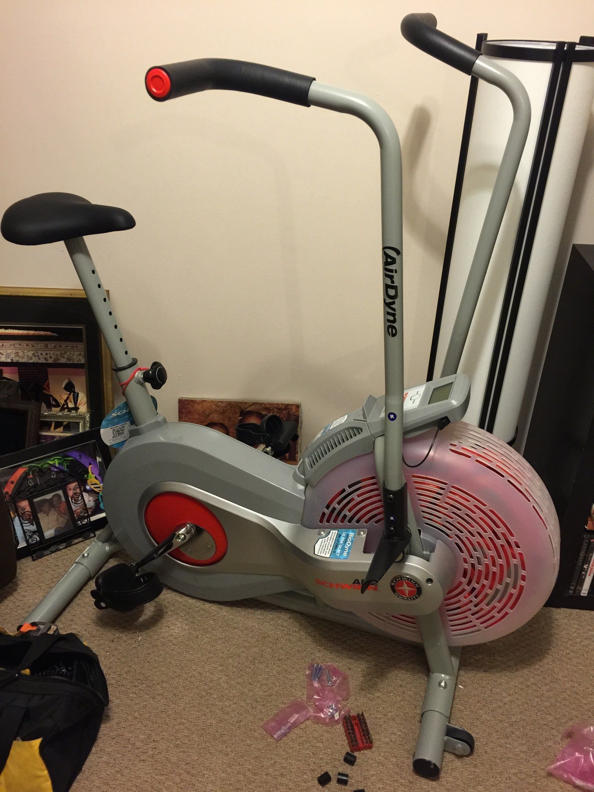 An exercise bike is sitting on the floor in a room