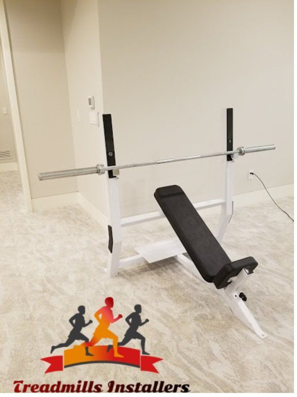 A treadmills installers logo next to a bench