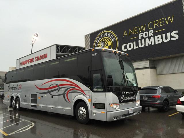 Gray Cardinal coach bus parked at MAPFRE Stadium in Columbus. 